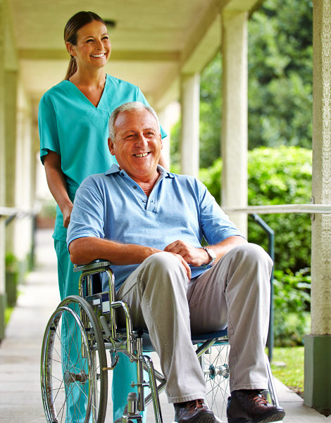 Caregiver with man in wheelchair.