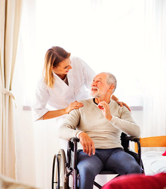 Caregiver with man in wheelchair.