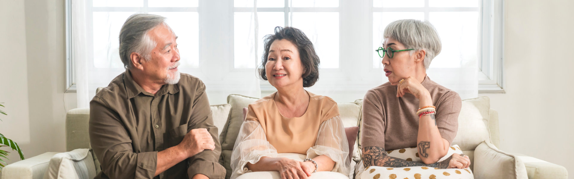 Elderly people talking and smiling.