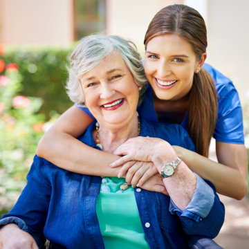 Two persons smiling.