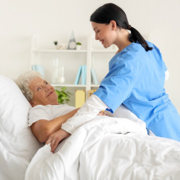 Nurse taking care of woman in the room.