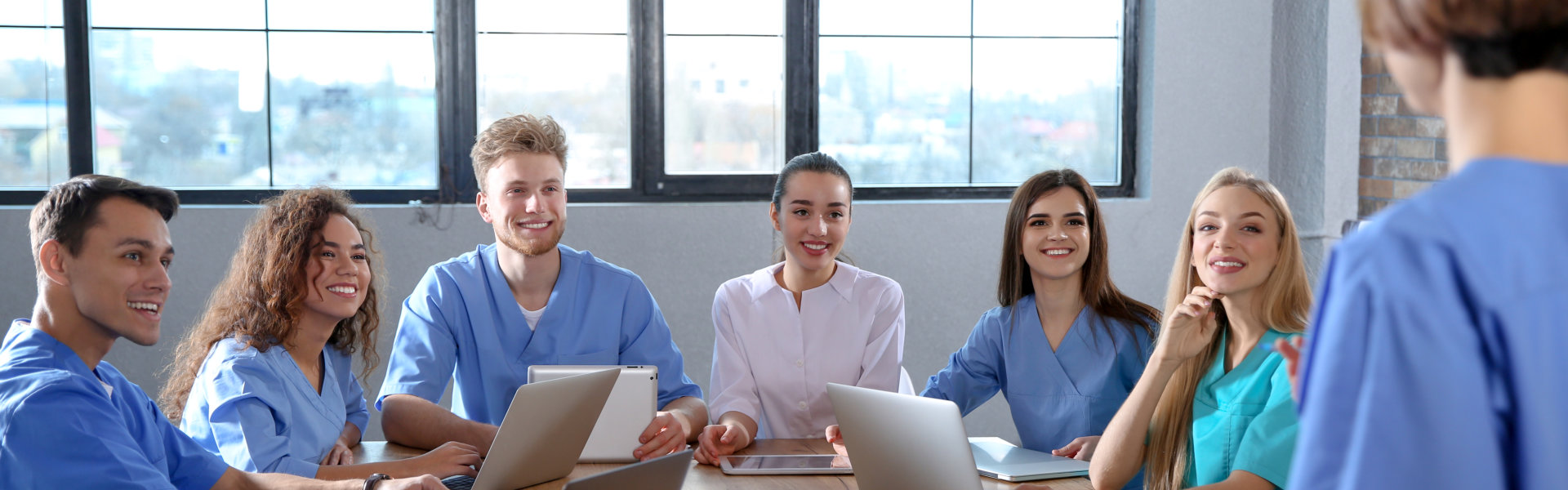 Group of nurses smiling.