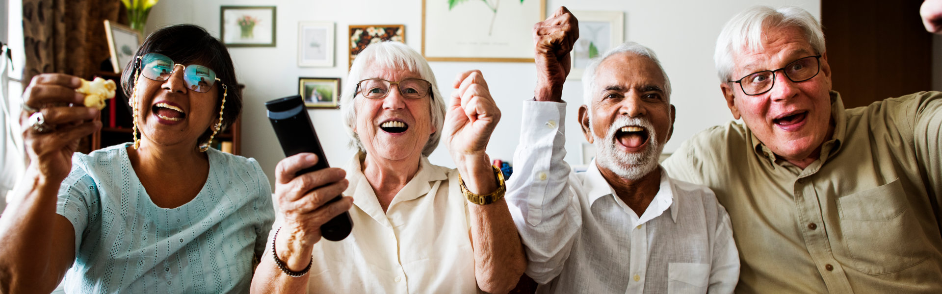 Group of elderly watching TV.