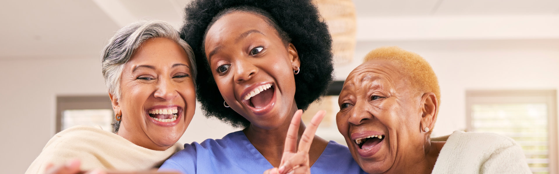 Nurse with two elderly taking a selfie.